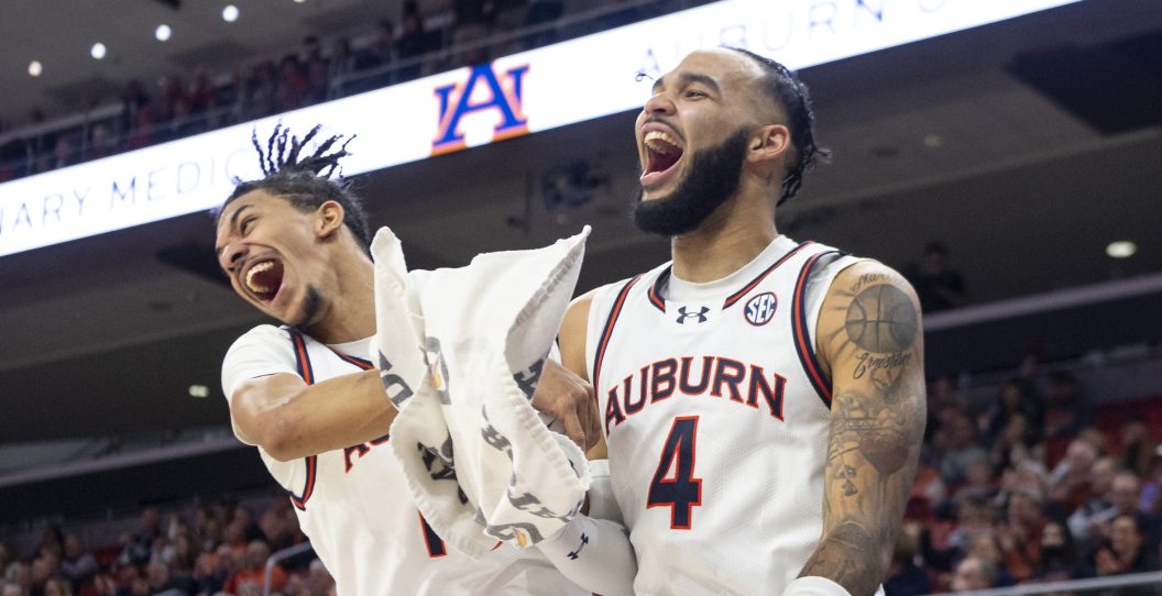 AUBURN, ALABAMA - JANUARY 31: Chad Baker-Mazara #10 of the Auburn Tigers and Tre Donaldson #3 of the Auburn Tigers react after a big play during their game against the Vanderbilt Commodores at Neville Arena on January 31, 2024 in