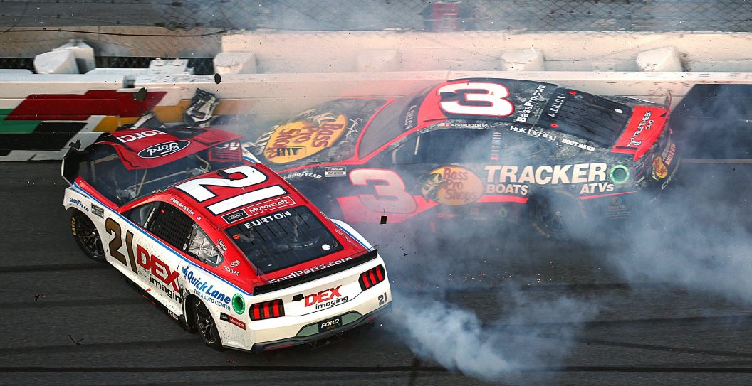 DAYTONA BEACH, FLORIDA - FEBRUARY 19: Harrison Burton, driver of the #21 Motorcraft/DEX Imaging Ford, and Austin Dillon, driver of the #3 Bass Pro Shops Chevrolet, spin after an on-track incident during the NASCAR Cup Series Daytona 500 at Daytona International Speedway on February 19, 2024 in Daytona Beach, Florida.