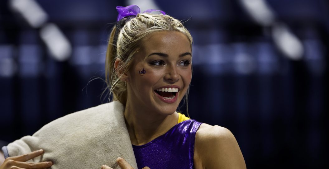 GAINESVILLE, FLORIDA - FEBRUARY 23: Olivia Dunne of the LSU Tigers laughs before a meet against the Florida Gators at the Stephen C. O'Connell Center on February 23, 2024 in Gainesville, Florida.