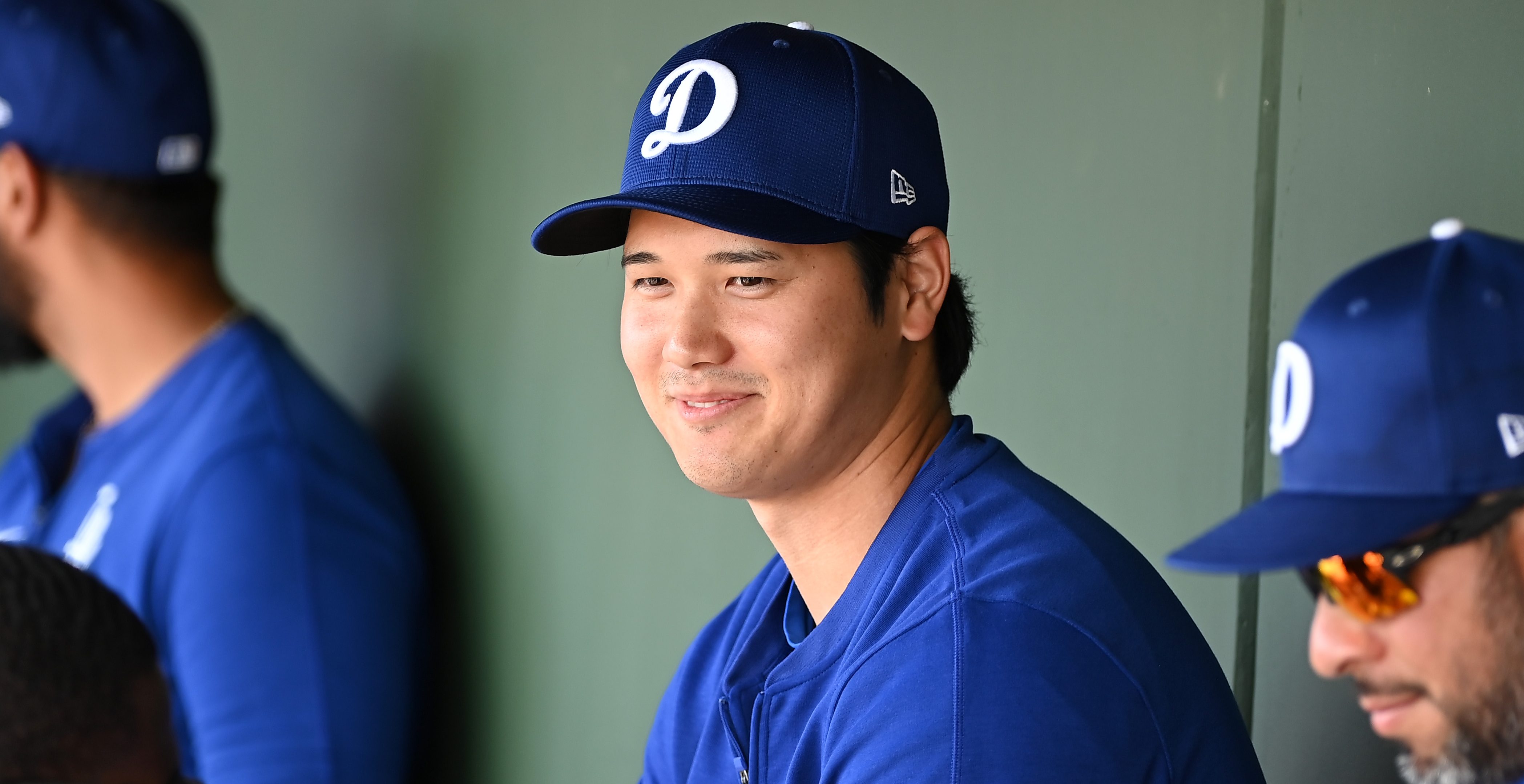 SURPRISE, ARIZONA - FEBRUARY 28: Shohei Ohtani #17 of the Los Angeles Dodgers looks on from the dugout against the Texas Rangers during a spring training game at Surprise Stadium on February 28, 2024 in Surprise, Arizona.