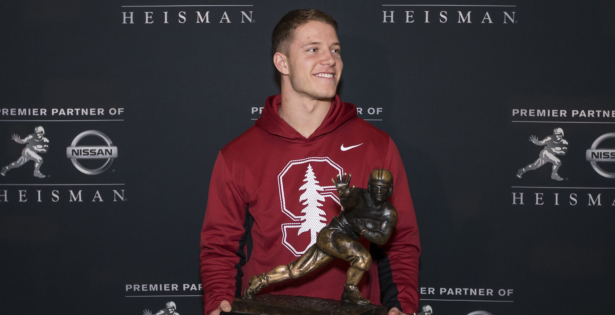 NEW YORK - DECEMBER 11: Heisman finalist Christian McCaffery, running back for Stanford University poses with the Heisman Trophy during media availability on December 11, 2015 at the Marriott Marquis in New York City. NOTE TO USER: Photographer approval needed for all Commercial License requests.