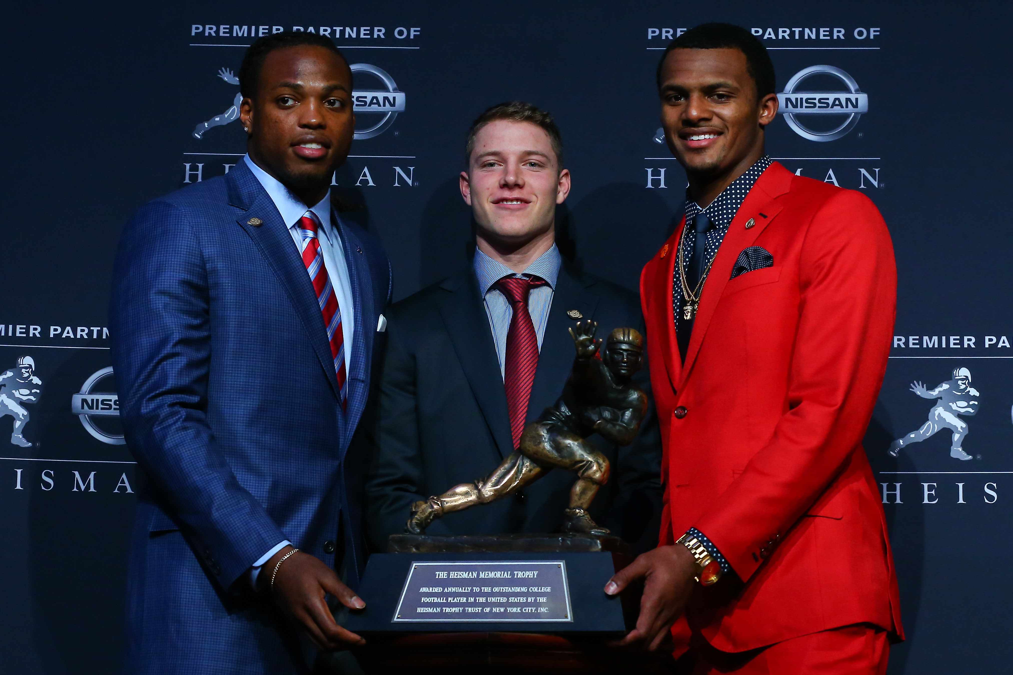 12 DEC 2015: University of Alabama running back Derrick Henry, Stanford University running back Christian McCaffrey, and Clemson University quarterback Deshaun Watson pose with the Heisman Trophy at a press conference prior to the 81st Annual Heisman award ceremony in New York City. (Photo by Rich Graessle/Icon Sportswire) 