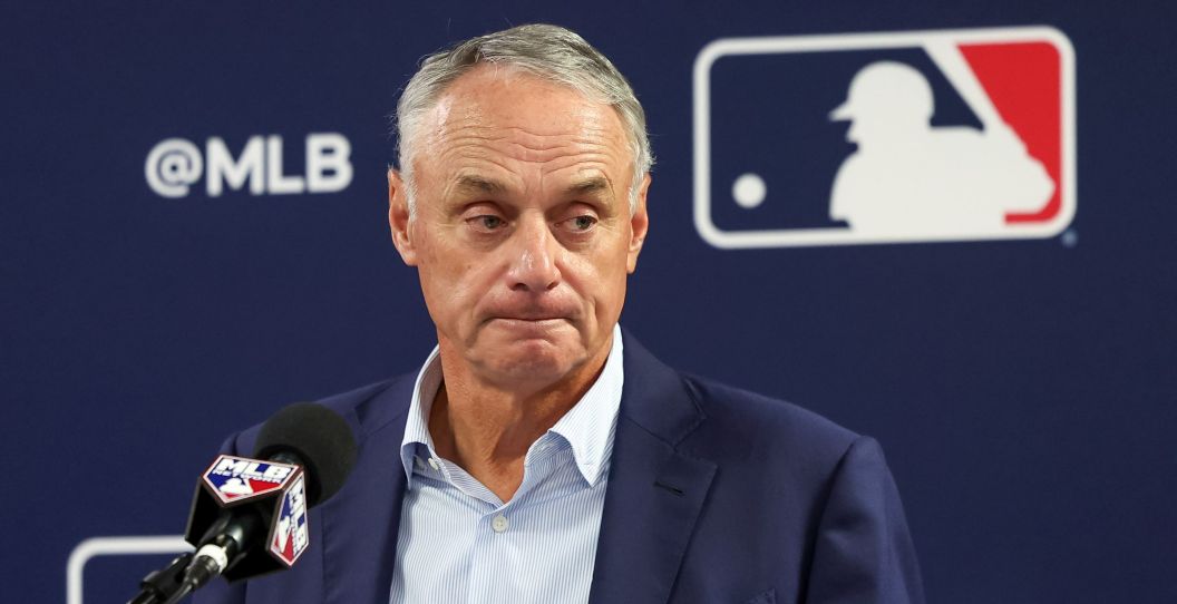 Rob Manfred speaks to reporters.