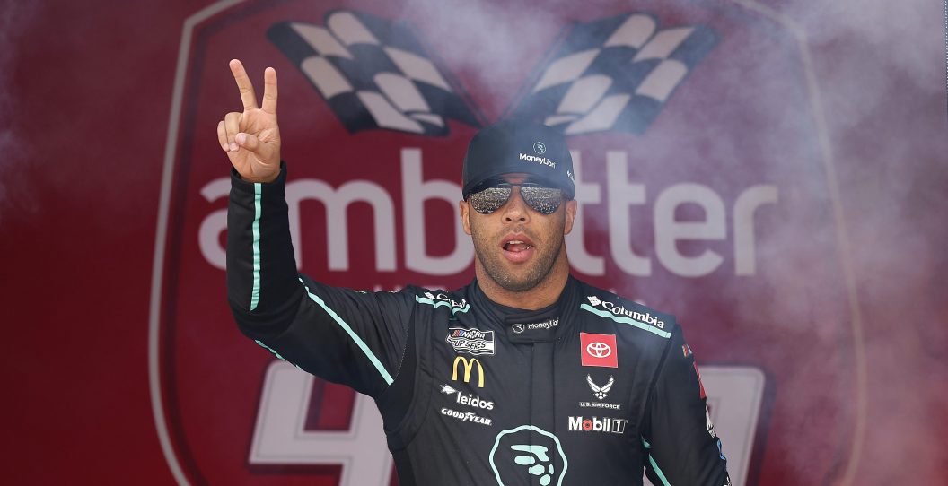 HAMPTON, GEORGIA - FEBRUARY 25: Bubba Wallace, driver of the #23 MoneyLion Toyota, waves to fans as he walks onstage during driver intros prior to the NASCAR Cup Series Ambetter Health 400 at Atlanta Motor Speedway on February 25, 2024 in Hampton, Georgia.