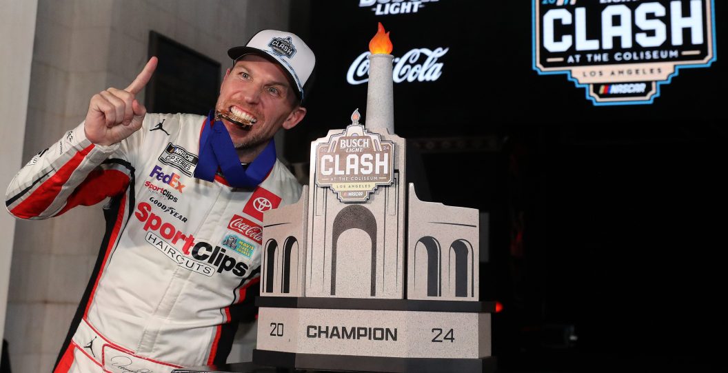 LOS ANGELES, CALIFORNIA - FEBRUARY 03: Denny Hamlin, driver of the #11 Sport Clips Haircuts Toyota, celebrates in victory lane after winning the NASCAR Cup Series Busch Light Clash at The Coliseum at Los Angeles Memorial Coliseum on February 03, 2024 in Los Angeles, California.
