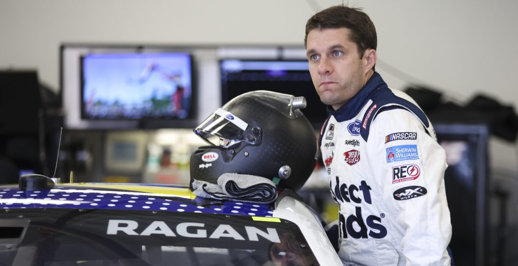DAYTONA BEACH, FLORIDA - FEBRUARY 15: David Ragan, driver of the #15 Select Blinds Ford, gets in his car in the garage area during practice for the NASCAR Cup Series 64th Annual Daytona 500 at Daytona International Speedway on February 15, 2022 in Daytona Beach, Florida.
