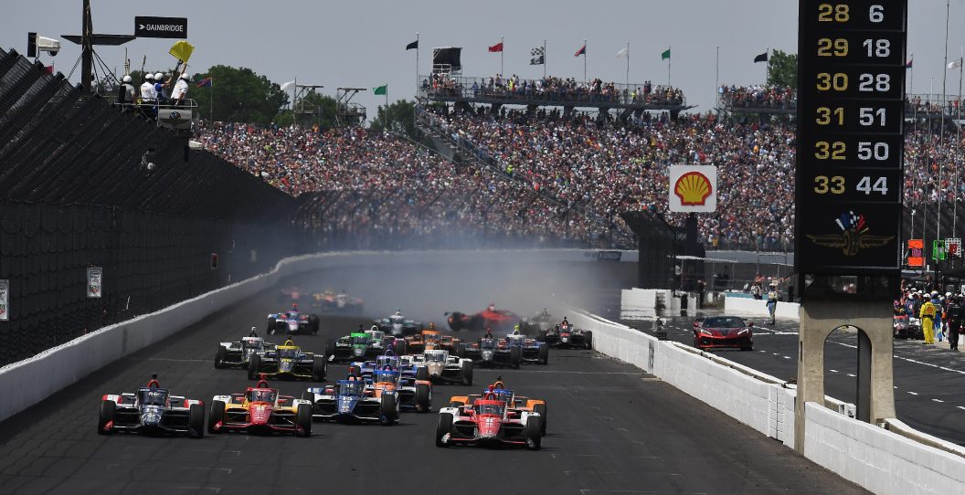 INDIANAPOLIS, IN - MAY 28: On a restart Marcus Ericsson (#8 Chip Ganassi Racing), Santino Ferrucci (#14 A.J. Foyt Enterprises) and Josef Newgarden (#2 Team Penske) race down the front stretch as Benjamin Pedersen (#55 A.J. Foyt Enterprises) spins during the NTT IndyCar Series Indianapolis 500 on May 28, 2023, at Indianapolis Motor Speedway in Indianapolis, Indiana.