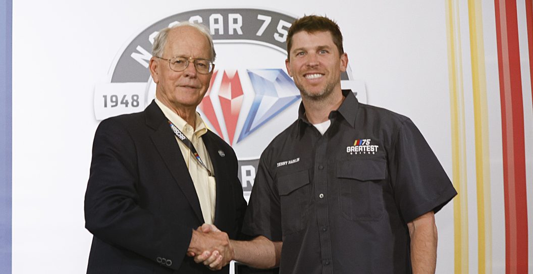 DARLINGTON, SOUTH CAROLINA - MAY 14: NASCAR Chairman and CEO Jim France (L) congratulates NASCAR Series Cup driver Denny Hamlin on selection to NASCAR's 75 Greatest Drivers list prior to the NASCAR Cup Series Goodyear 400 at Darlington Raceway on May 14, 2023 in Darlington, South Carolina.