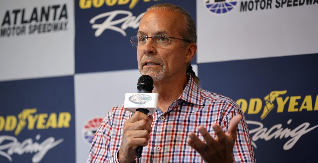 HAMPTON, GEORGIA - JULY 09: NASCAR commentator, Kyle Petty, (L) speaks to the media during a press conference for Goodyear's 2000th NASCAR Cup Series Victory prior to the NASCAR Cup Series Quaker State 400 Available at Walmart at Atlanta Motor Speedway on July 09, 2023 in Hampton, Georgia.