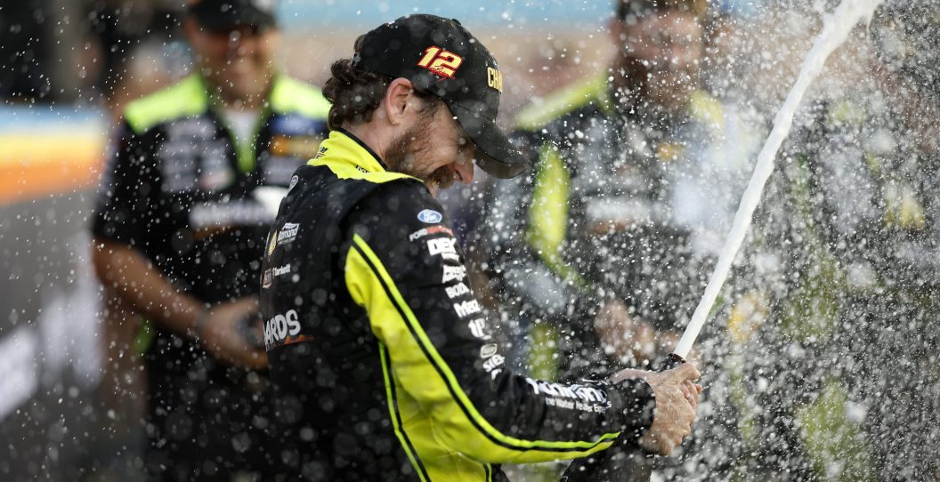 AVONDALE, ARIZONA - NOVEMBER 05: Ryan Blaney, driver of the #12 Menards/Dutch Boy Ford, and crew spray champagne in victory lane after winning the 2023 NASCAR Cup Series Championship, finishing first of the Championship 4 drivers in the NASCAR Cup Series Championship race at Phoenix Raceway on November 05, 2023 in Avondale, Arizona.