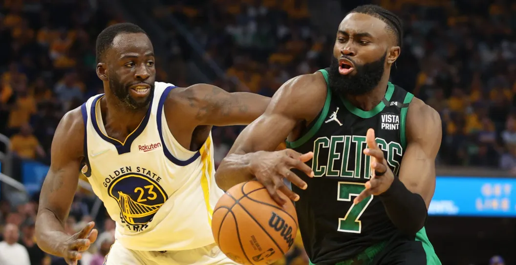 SAN FRANCISCO, CALIFORNIA - JUNE 13: Jaylen Brown #7 of the Boston Celtics loses control of the ball against Draymond Green #23 of the Golden State Warriors during the second quarter in Game Five of the 2022 NBA Finals at Chase Center on June 13, 2022 in San Francisco, California. NOTE TO USER: User expressly acknowledges and agrees that, by downloading and/or using this photograph, User is consenting to the terms and conditions of the Getty Images License Agreement.