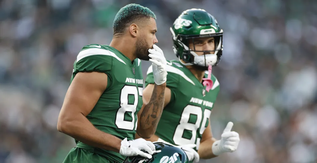 EAST RUTHERFORD, NEW JERSEY - OCTOBER 15: C.J. Uzomah #87 and Jeremy Ruckert #89 of the New York Jets run off the field during the first half in the game against the Philadelphia Eagles at MetLife Stadium on October 15, 2023 in East Rutherford, New Jersey.