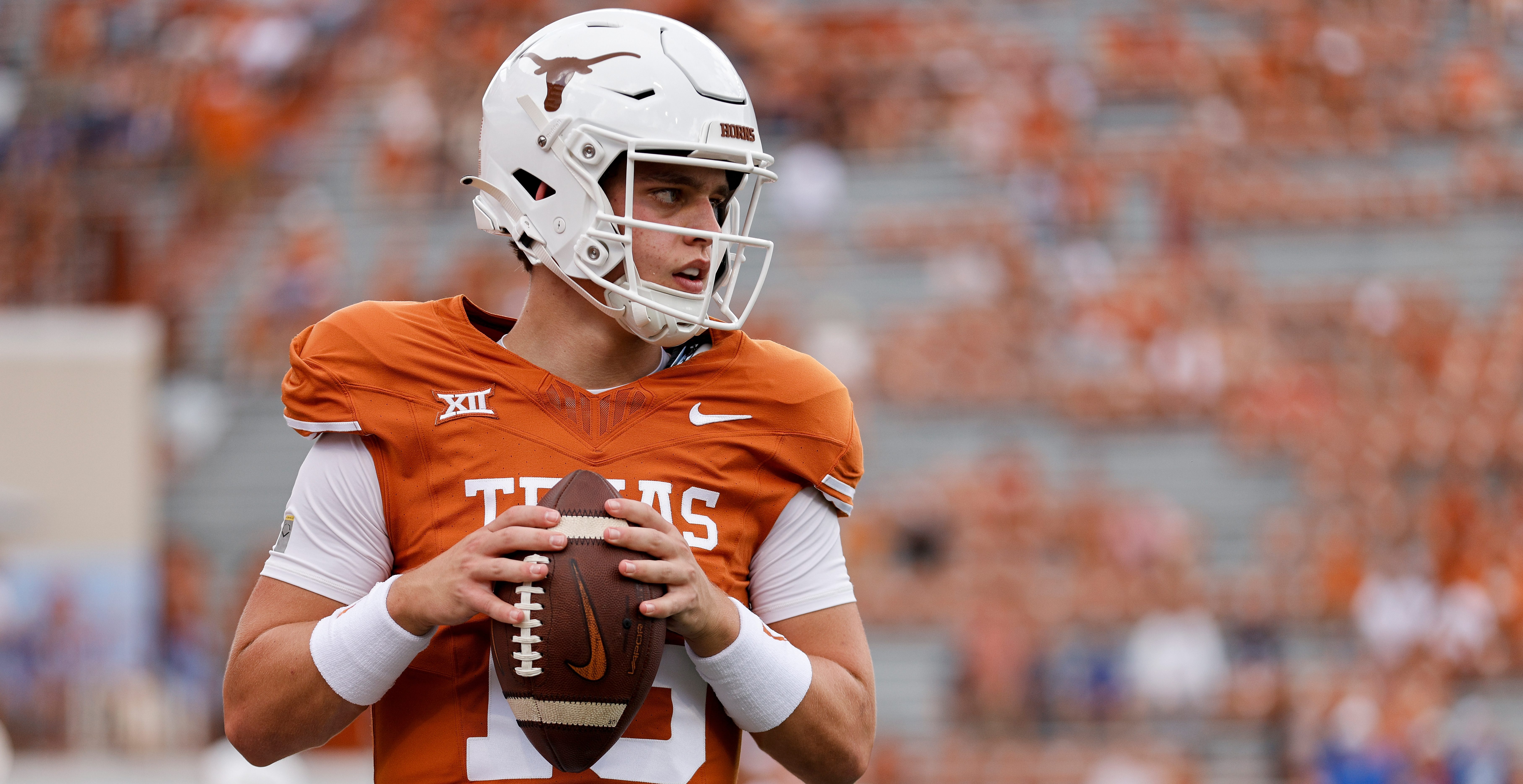 AUSTIN, TEXAS - OCTOBER 28: Arch Manning #16 of the Texas Longhorns warms up before the game against the Brigham Young Cougars at Darrell K Royal-Texas Memorial Stadium on October 28, 2023 in Austin, Texas.