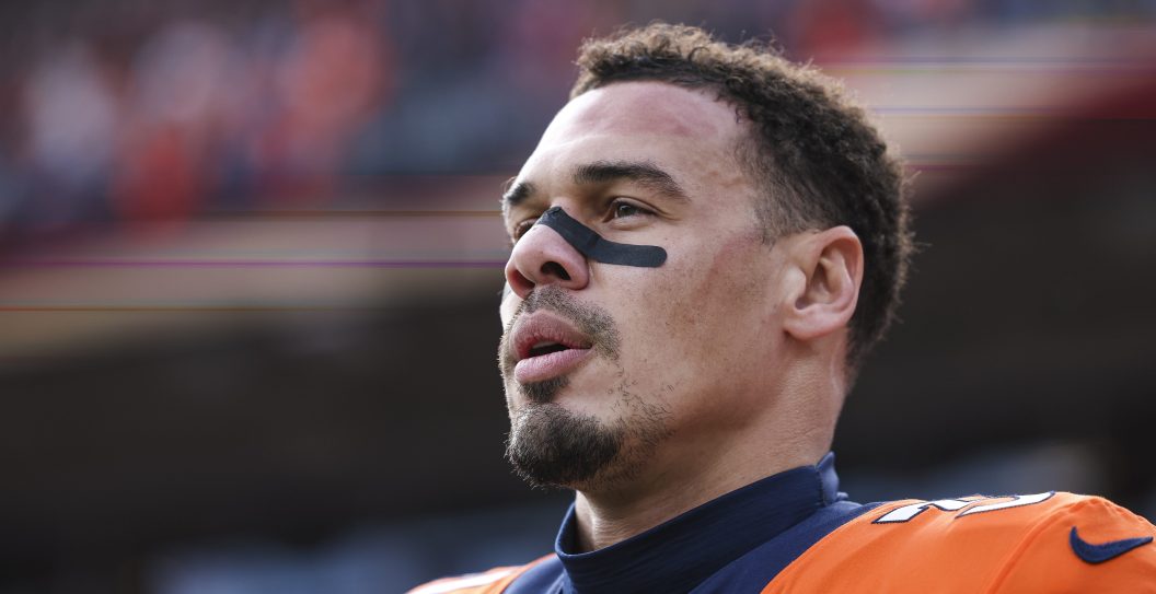 DENVER, CO - DECEMBER 31: Justin Simmons #31 of the Denver Broncos looks on from the sideline during the antional anthem prior to an NFL football game against the Los Angeles Chargers at Empower Field at Mile High on December 31, 2023 in Denver, Colorado.