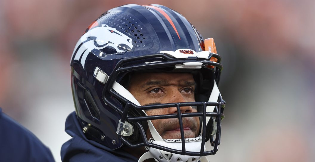 DENVER, CO - DECEMBER 31: Russell Wilson #3 of the Denver Broncos looks on from the sideline during an NFL football game against the Los Angeles Chargers at Empower Field at Mile High on December 31, 2023 in Denver, Colorado.