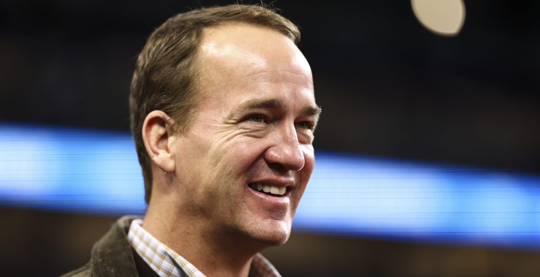 DETROIT, MI - JANUARY 21: Former quarterback Peyton Manning smiles on the field prior to an NFL divisional round playoff football game between the Detroit Lions and the Tampa Bay Buccaneers at Ford Field on January 21, 2024 in Detroit, Michigan.