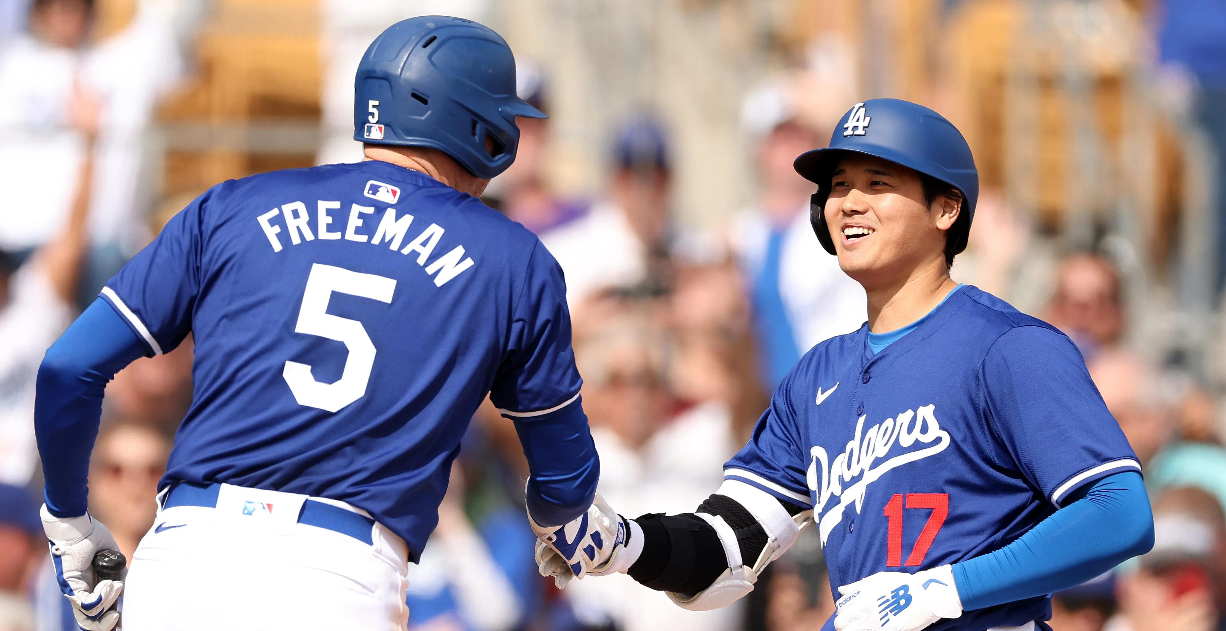 GLENDALE, ARIZONA - FEBRUARY 27: Shohei Ohtani #17 celebrates with Freddie Freeman #5 of the Los Angeles Dodgers after hitting a two-run home run in the fifth inning inning during a game against the Chicago White Sox at Camelback Ranch on February 27, 2024 in Glendale, Arizona.