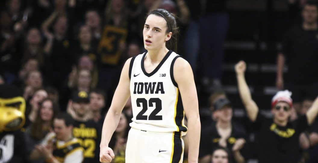 IOWA CITY, IOWA- MARCH 3: Guard Caitlin Clark #22 of the Iowa Hawkeyes is applauded during the second half after a basket against the Ohio State Buckeyes at Carver-Hawkeye Arena on March 3, 2024 in Iowa City, Iowa.