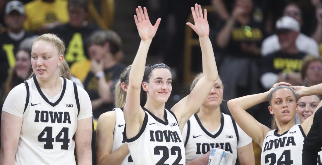 IOWA CITY, IOWA- MARCH 3: Guard Caitlin Clark #22 of the Iowa Hawkeyes waves to the crowd during senior day festivities after the match-up against the Ohio State Buckeyes at Carver-Hawkeye Arena on March 3, 2024 in Iowa City, Iowa.