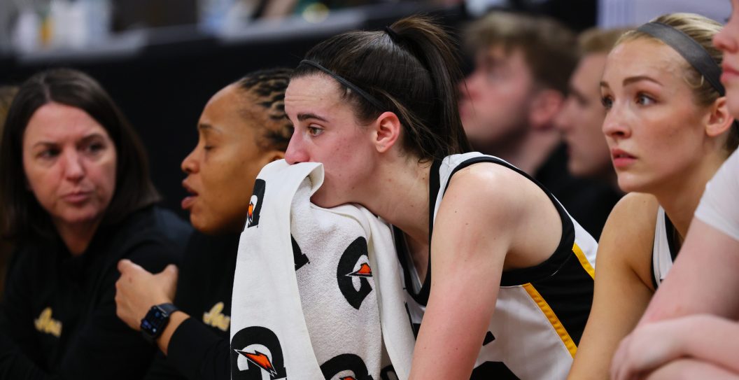 MINNEAPOLIS, MINNESOTA - MARCH 10: Caitlin Clark #22 of the Iowa Hawkeyes reacts on the bench in the first half against the Nebraska Cornhuskers during the Big Ten Women's Basketball Tournament Championship at Target Center on March 10, 2024 in Minneapolis, Minnesota.
