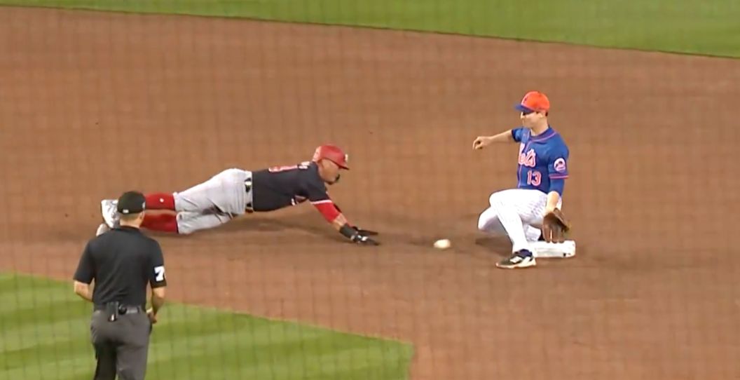 Joey Wendle is called for obstruction against a Nationals player.