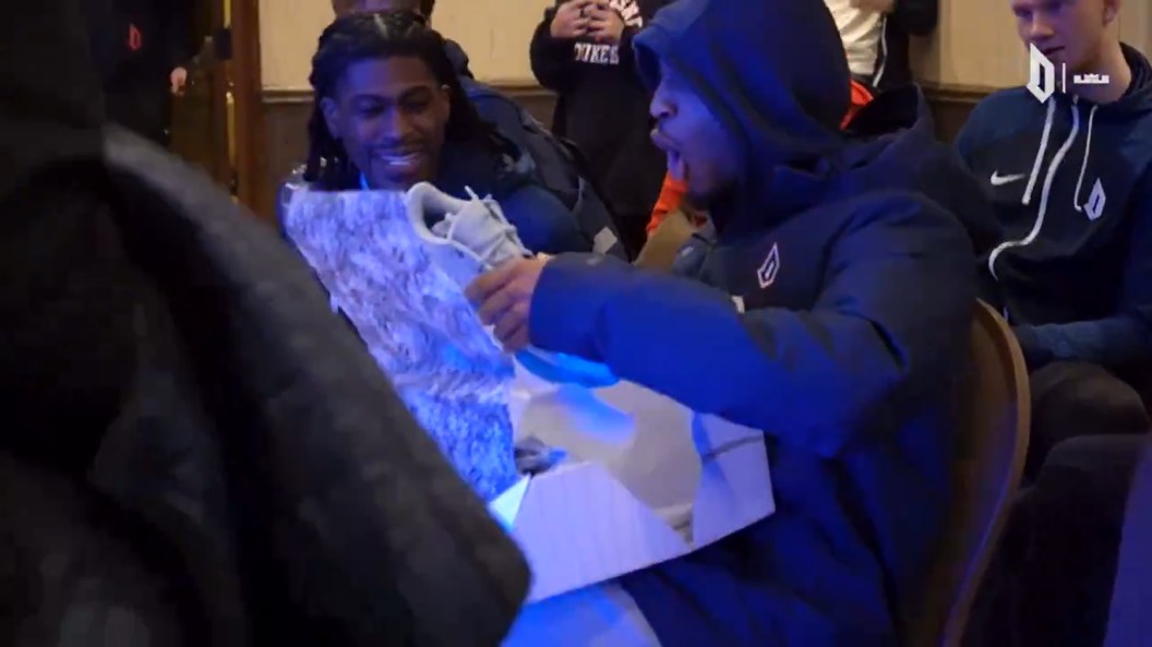 Members of the Duquesne basketball team open boxes of new sneakers from NBA star LeBron James. (Twitter/X)