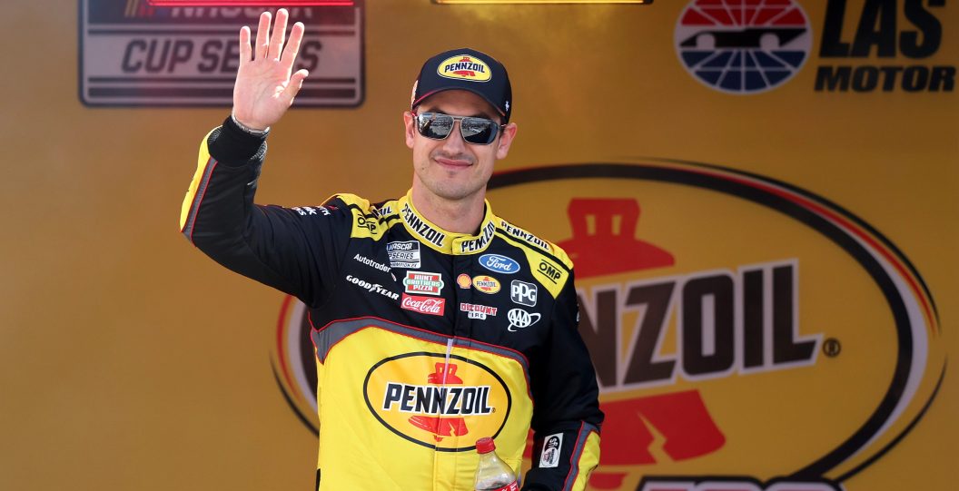 LAS VEGAS, NEVADA - MARCH 03: Joey Logano, driver of the #22 Pennzoil Ford, waves to fans as he walks onstage during driver intros prior to the NASCAR Cup Series Pennzoil 400 at Las Vegas Motor Speedway on March 03, 2024 in Las Vegas, Nevada.