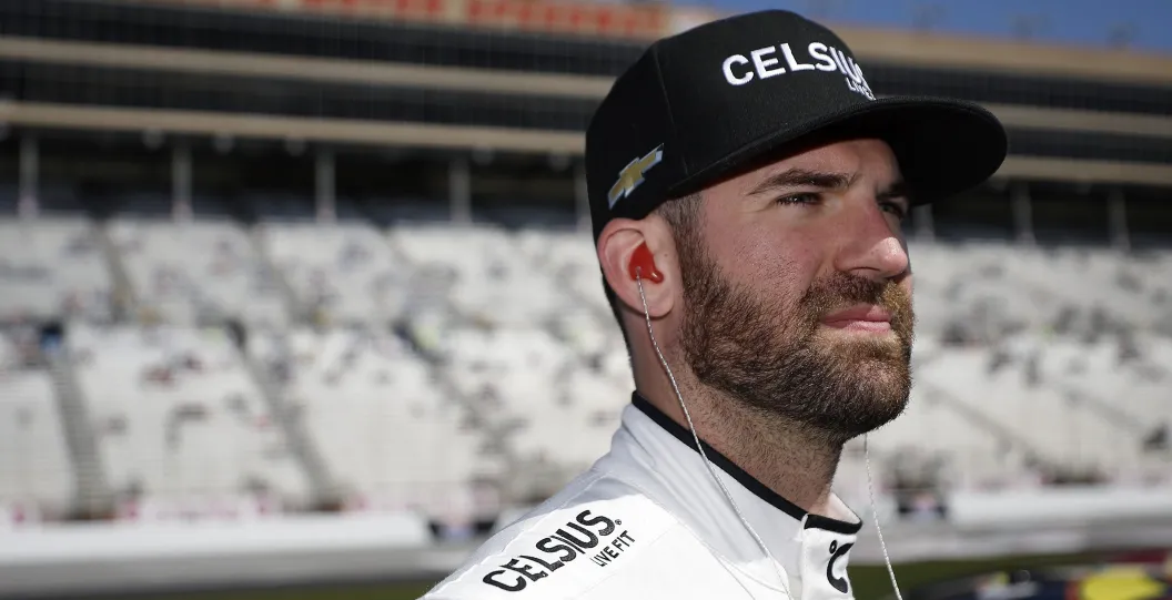 HAMPTON, GEORGIA - FEBRUARY 24: Corey LaJoie, driver of the #7 Celsius Chevrolet, looks on during qualifying for the NASCAR Cup Series Ambetter Health 400 at Atlanta Motor Speedway on February 24, 2024 in Hampton, Georgia.