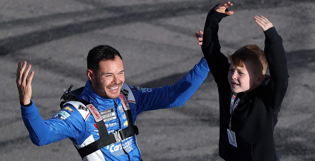 LAS VEGAS, NEVADA - MARCH 03: Kyle Larson, driver of the #5 HendrickCars.com Chevrolet, celebrates with his son, Owen Larson after winning the NASCAR Cup Series Pennzoil 400 at Las Vegas Motor Speedway on March 03, 2024 in Las Vegas, Nevada.