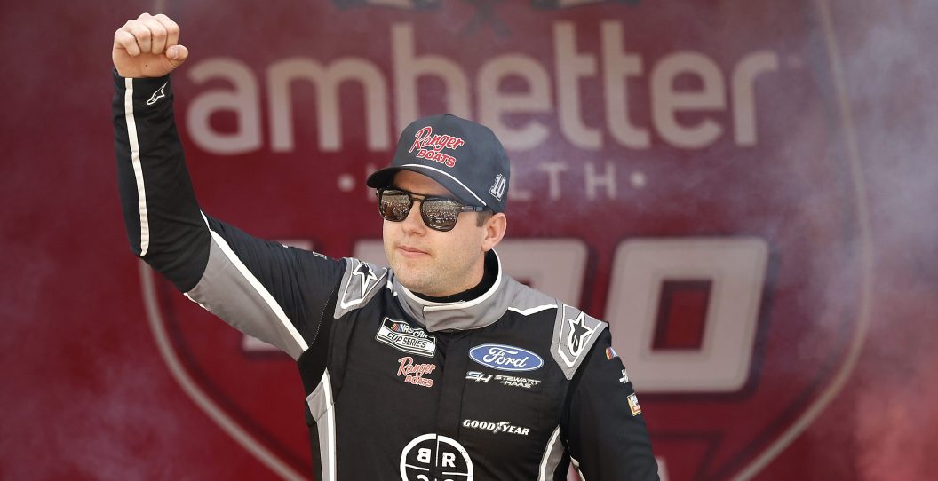 HAMPTON, GEORGIA - FEBRUARY 25: Noah Gragson, driver of the #10 Black Rifle Coffee/Ranger Boats Ford, waves to fans as he walks onstage during driver intros prior to the NASCAR Cup Series Ambetter Health 400 at Atlanta Motor Speedway on February 25, 2024 in Hampton, Georgia.