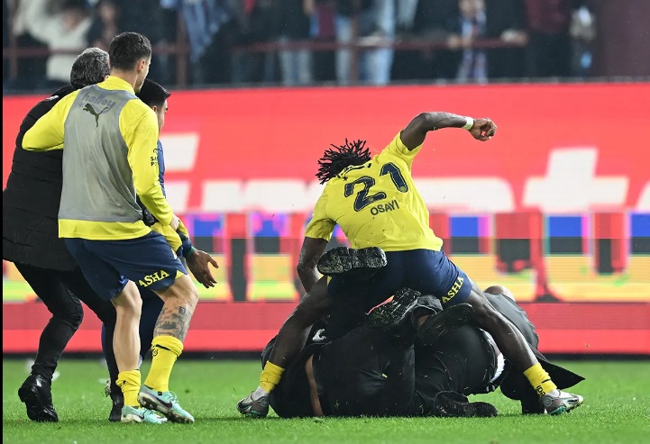 Fenerbahce's Bright Osayi-Samuel was among those captured on video giving a beating to some of the rowdy Trabzonspor fans who stormed the field.