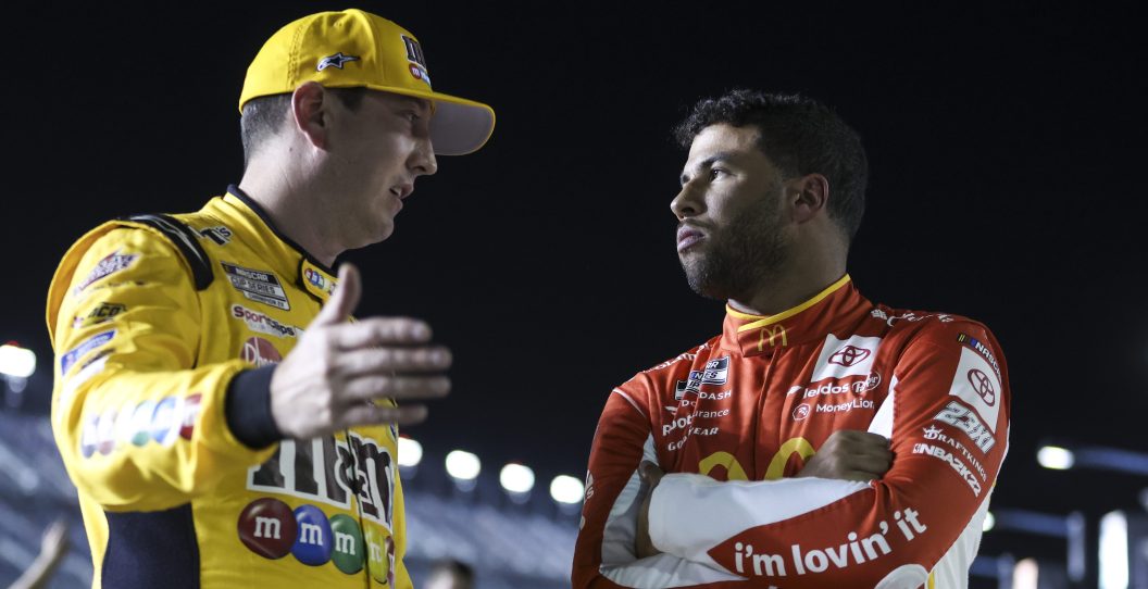 DAYTONA BEACH, FLORIDA - FEBRUARY 16: Bubba Wallace, driver of the #23 McDonald's Toyota, talks with Kyle Busch, driver of the #18 M&M's Toyota, on pit lane during qualifying for the NASCAR Cup Series 64th Annual Daytona 500 at Daytona International Speedway on February 16, 2022 in Daytona Beach, Florida.