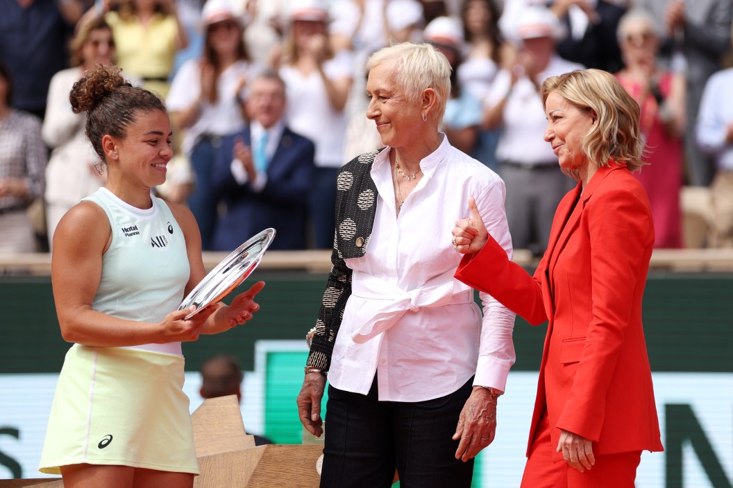 PARIS, FRANCE - JUNE 08: Jasmine Paolini of Italy is presented with her runners-up trophy by Martina Navratilova, Former Tennis Player, and Chris Evert, Former Tennis Player, during the trophy presentation after the Women's Singles Final match between Iga Swiatek of Poland and Jasmine Paolini of Italy on Day 14 of the 2024 French Open at Roland Garros.